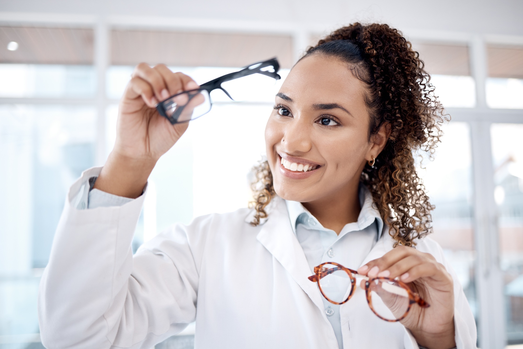 Eye care, vision and black woman, glasses choice and optometrist, healthcare for eyes with doctor a